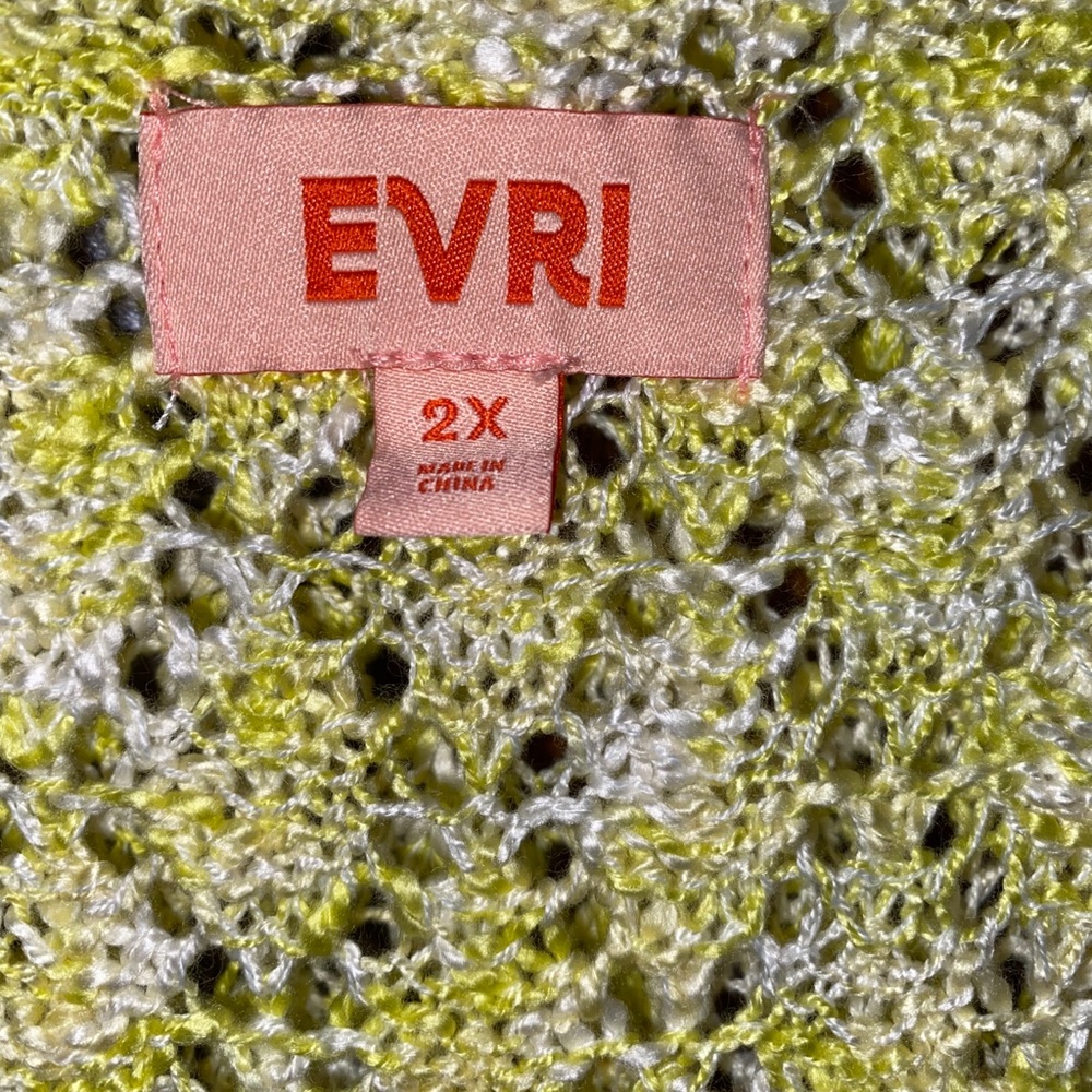 Woman’s yellow and cream sweater